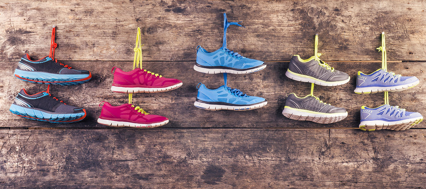 running shoes hanging on wall