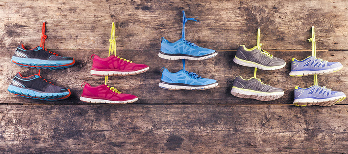 running shoes hanging on wall