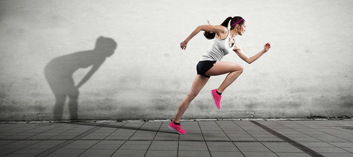 female running with her shadow shown resting