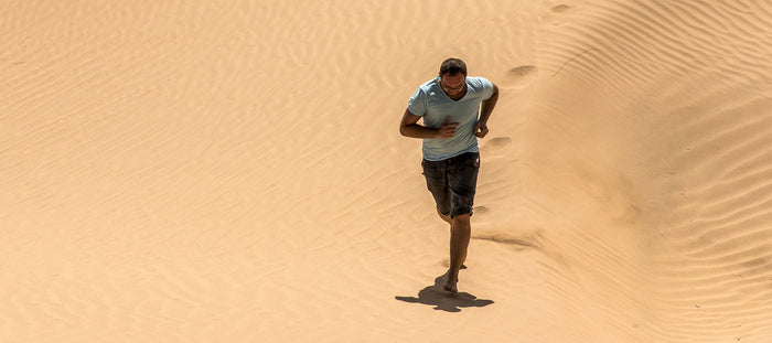 Man running in sand
