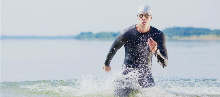 male swimmer competing in triathlon