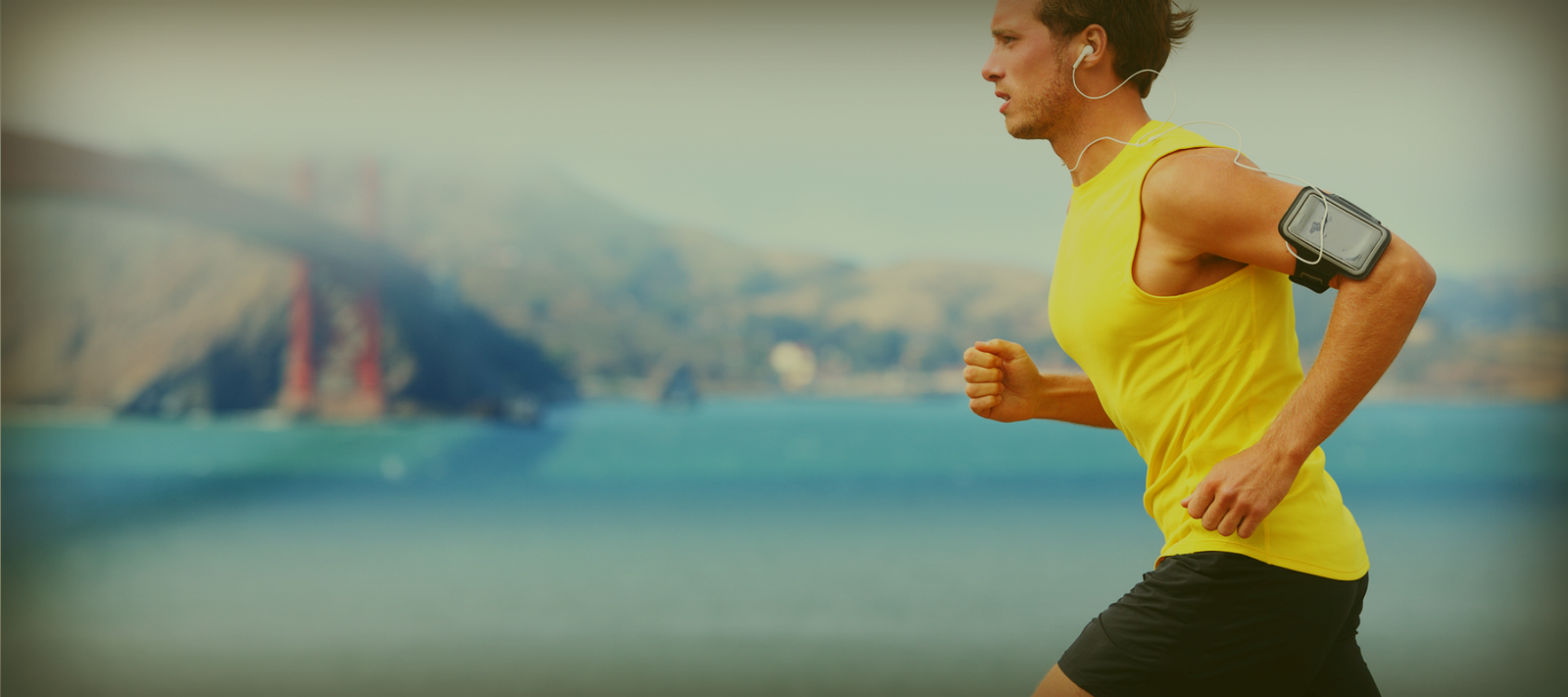 man running along river