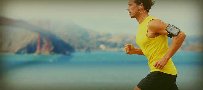 man running along river