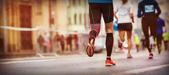Runners in marathon on city streets