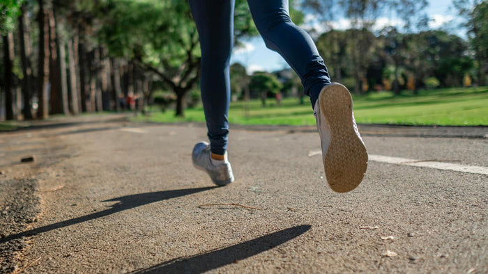 a shot of a woman's feet in stride