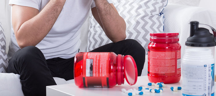 man taking fitness supplements