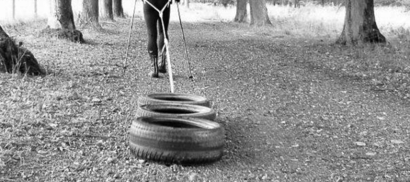 athlete pulling tires