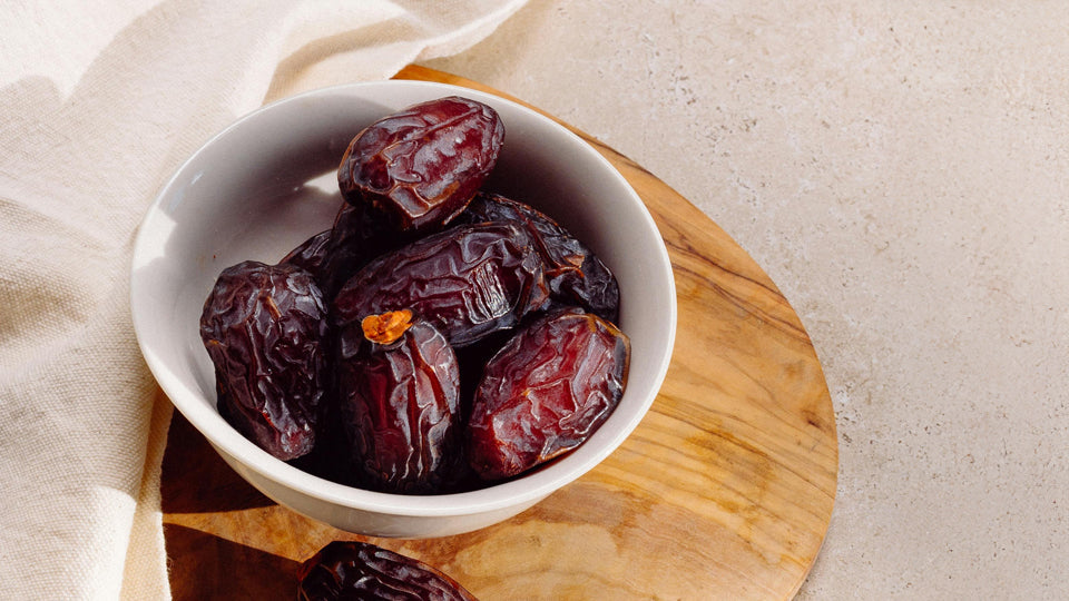 a bowl of dates on a table